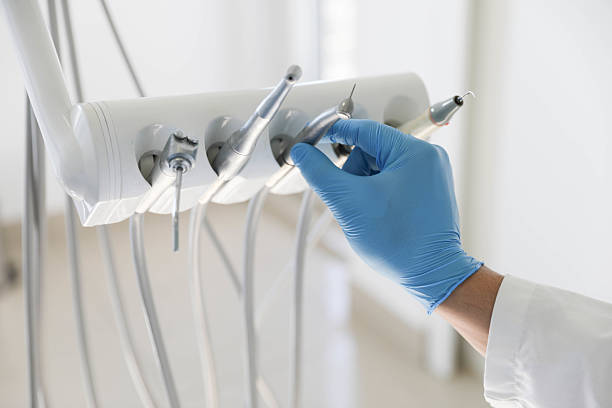 Professional Tooth Extraction technician working in Clinton, MI